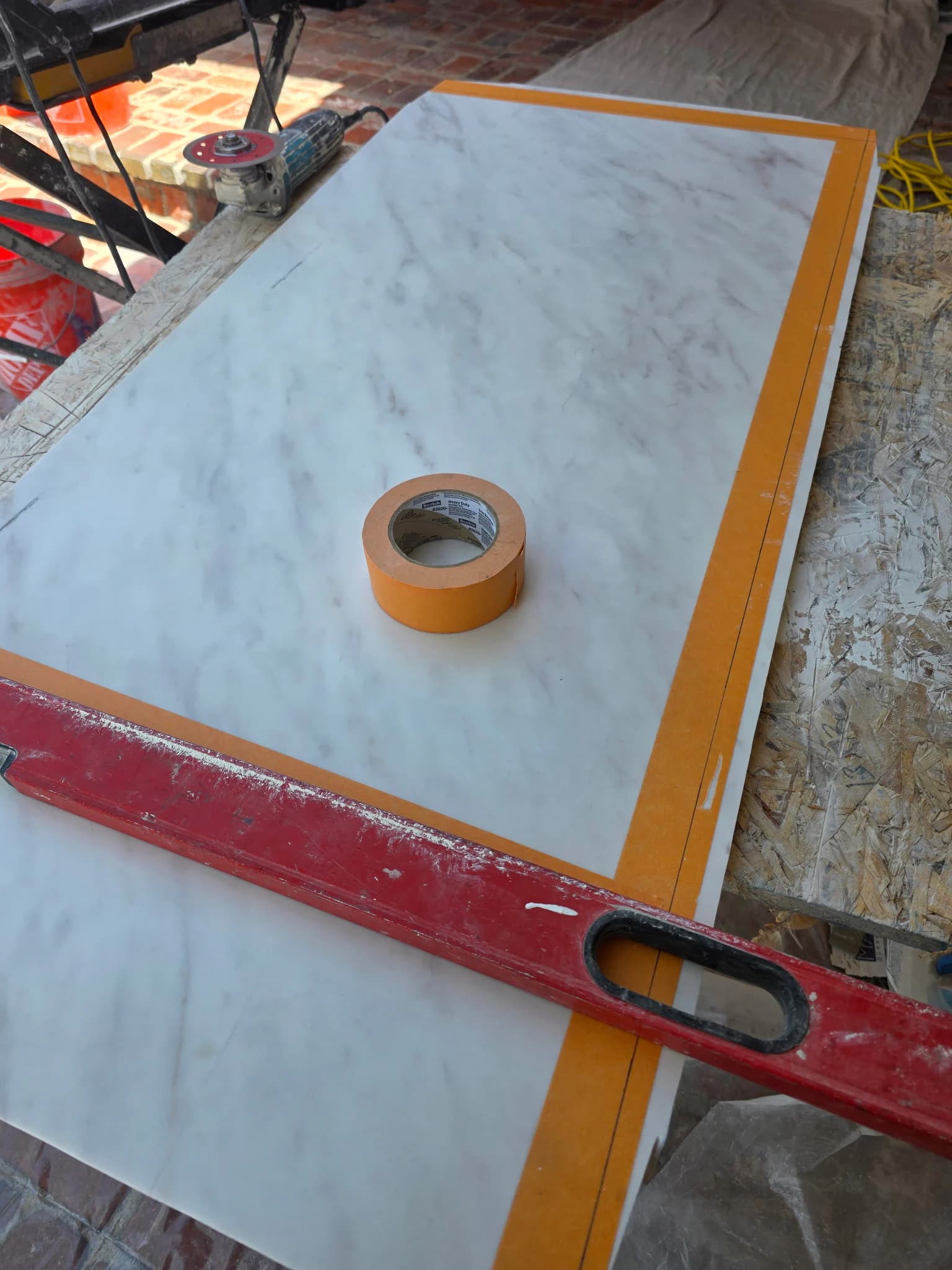 Large-format tile being measured and prepared before installation